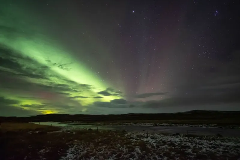 Aurora borealis over a river in Iceland