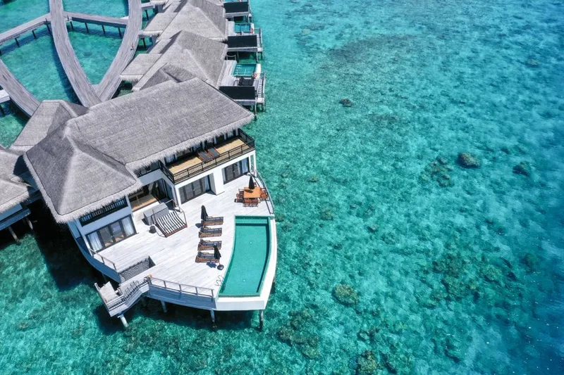 Overwater villa surrounded by turquoise water in the Maldives