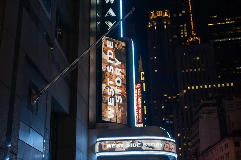 Illuminated Broadway theater sign at night in New York