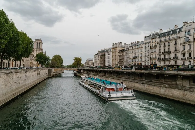 Boat cruising along the Seine in Paris